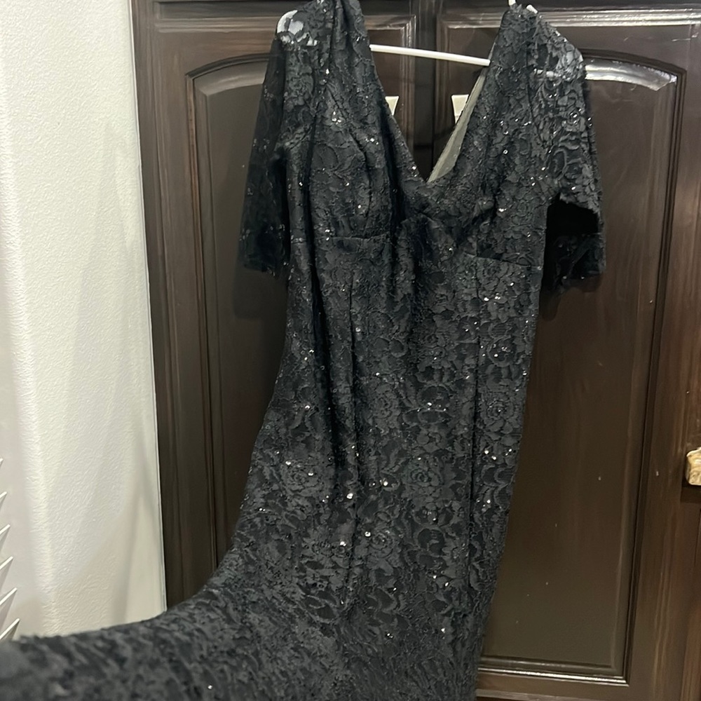 Selling a black, long lace dress. It’s in excellent condition.